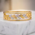 Aurora Laurel Mixed-Metal Bangle – Two-Tone Leaf Motif Hinge Bracelet