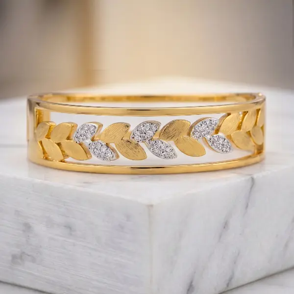 Aurora Laurel Mixed-Metal Bangle – Two-Tone Leaf Motif Hinge Bracelet