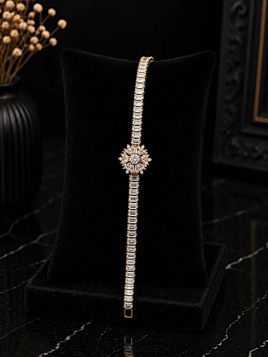 Gold plated zircon tennis bracelet with starburst flower center on black velvet display