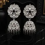 Silver floral Kundan jhumka earrings with black center stones and black crystal bead drops