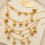 Gold multi layered jhumki sahara hair chains with mini bell charms