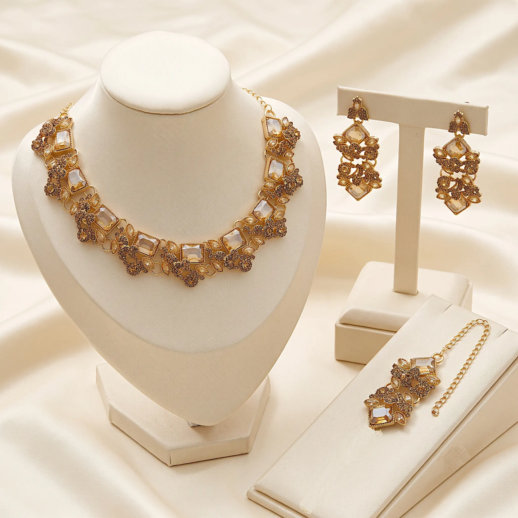 Gold champagne crystal choker necklace set with statement earrings and maang tikka