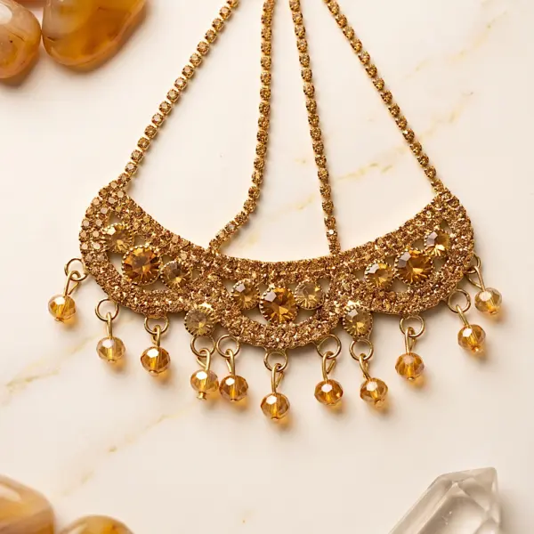 Gold crystal Jhumar passa hair jewelry with amber stones, rhinestone chains, and hanging faceted crystal beads