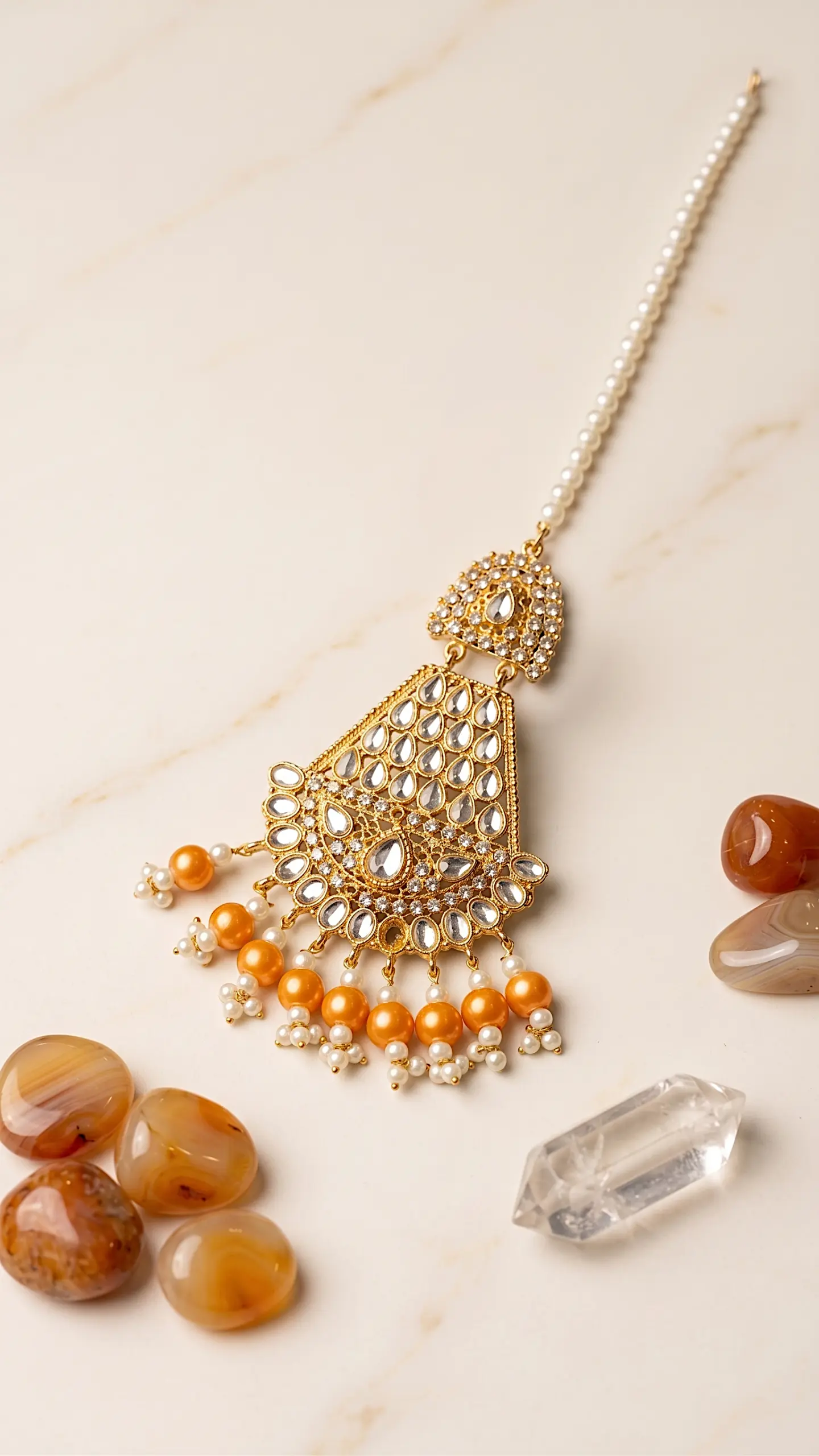 Traditional gold plated Kundan Jhumar passa with orange pearl drops and pearl chain for Mehndi hairstyles