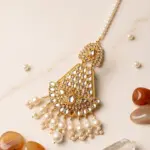 Traditional gold plated bridal Kundan Jhumar passa with hanging pearl drops and pearl chain strand